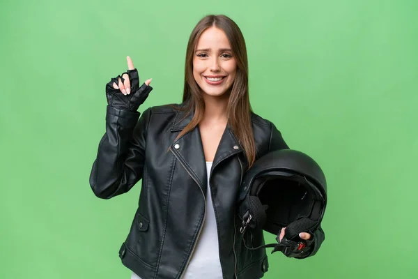 若いです可愛いですCaucasian女性とともにオートバイヘルメット上の隔離された背景指摘素晴らしいアイデア — ストック写真