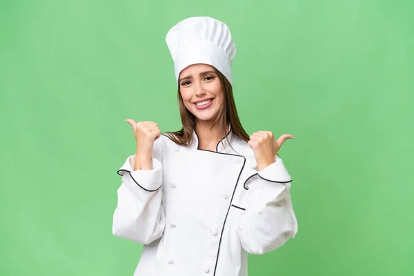 Joven Chef Mujer Caucásica Sobre Fondo Aislado Con Los Pulgares —  Fotos de Stock