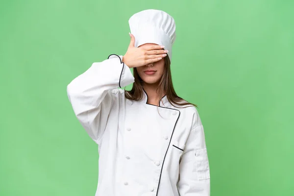 stock image Young chef caucasian woman over isolated background covering eyes by hands. Do not want to see something