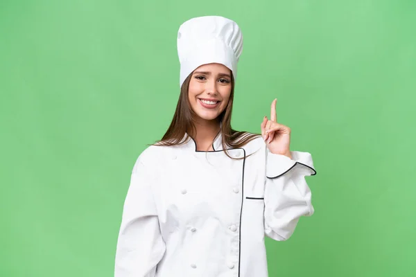 Jovem Chef Mulher Caucasiana Sobre Fundo Isolado Mostrando Levantando Dedo — Fotografia de Stock