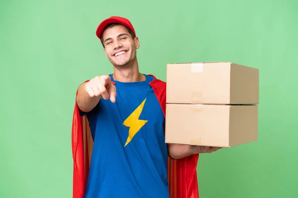 Super Hero Delivery Man Isolated Background Pointing Front Happy Expression — Stock Photo, Image
