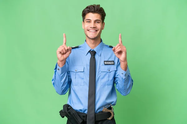Młody Policjant Odosobnionym Pochodzeniem Wskazuje Świetny Pomysł — Zdjęcie stockowe