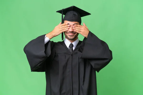 Jovem Universitário Graduado Homem Sobre Isolado Fundo Cobrindo Olhos Por — Fotografia de Stock