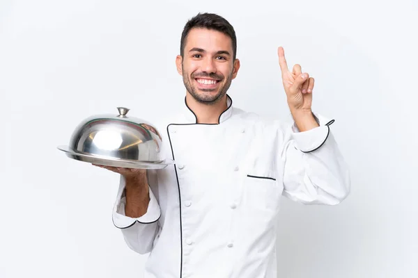 Jeune Chef Avec Plateau Isolé Sur Fond Blanc Pointant Vers — Photo