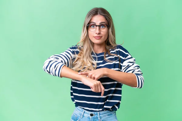 stock image Young Uruguayan woman over isolated background making the gesture of being late