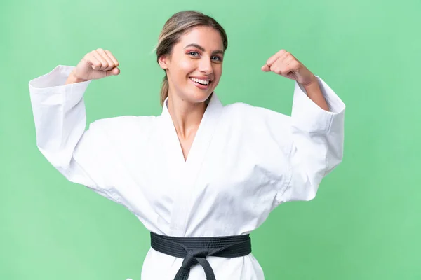 Mujer Uruguaya Joven Haciendo Karate Sobre Fondo Aislado Haciendo Gesto — Foto de Stock