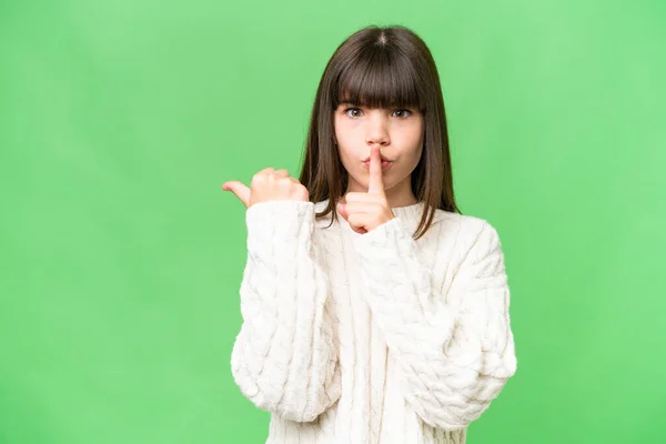 Little Caucasian Girl Isolated Background Pointing Side Doing Silence Gesture — Stock Photo, Image