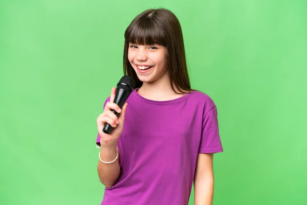 Little Singer Girl Picking Microphone Isolated Background Smiling Lot — Stock Photo, Image