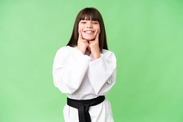 Little Caucasian Girl Doing Karate Isolated Background Smiling Happy Pleasant — Stock Photo, Image