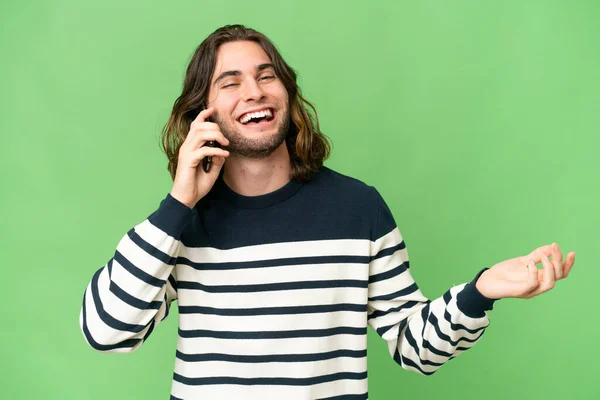 Young Handsome Man Isolated Background Keeping Conversation Mobile Phone Someone — Stock Photo, Image