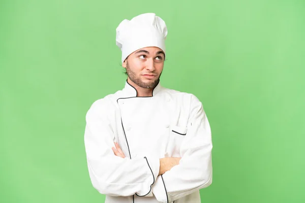 Joven Guapo Chef Hombre Sobre Aislado Fondo Haciendo Dudas Gesto — Foto de Stock