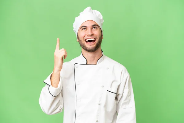Jeune Beau Chef Homme Sur Fond Isolé Pointant Vers Haut — Photo