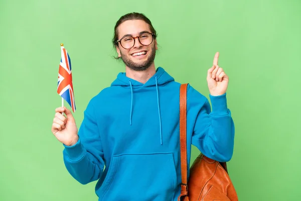 Mladý Pohledný Muž Drží Britskou Vlajku Nad Izolovaným Pozadím Ukazující — Stock fotografie