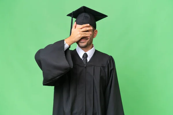 Jovem Universitário Graduado Homem Sobre Isolado Fundo Cobrindo Olhos Por — Fotografia de Stock