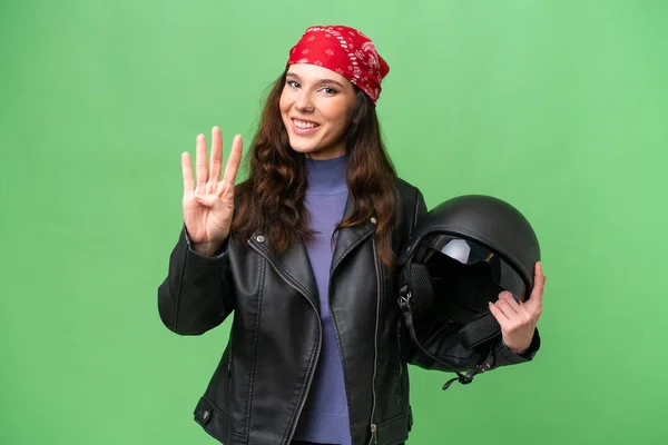 若いですCaucasian女性とともにオートバイヘルメット上の隔離された背景幸せとカウント4とともに指 — ストック写真