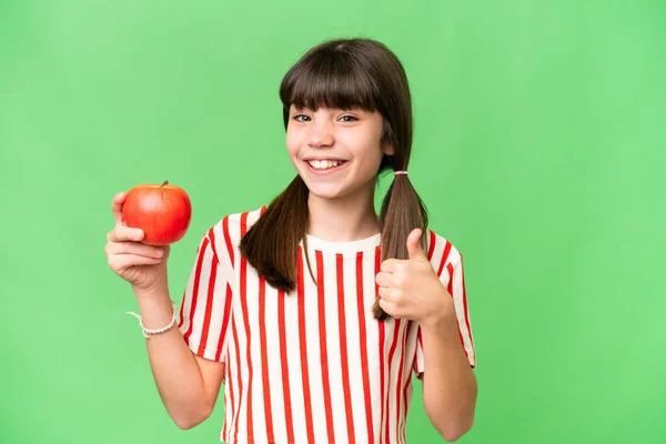 Kis Kaukázusi Lány Egy Almát Tart Elszigetelt Háttérben Hüvelykujjal Felfelé — Stock Fotó