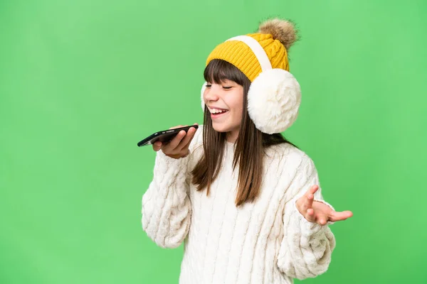 Little Caucasian Girl Wearing Winter Muffs Isolated Background Keeping Conversation — Stock Photo, Image