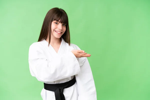 Little Caucasian Girl Doing Karate Isolated Background Presenting Idea While — Stock Photo, Image