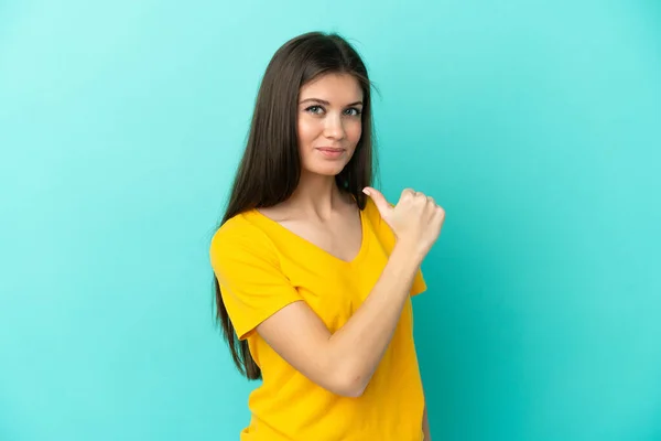 stock image Young caucasian woman isolated on blue background proud and self-satisfied