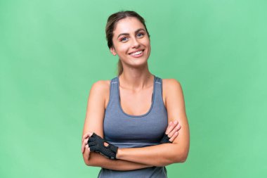Güzel Sport Uruguaylı kadın izole arka planda kollarını ön cephede kavuşturuyor.