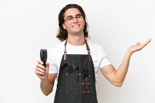 stock image Young hairdresser man isolated on white background extending hands to the side for inviting to come