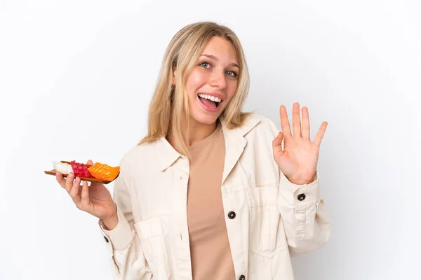 Young Caucasian Woman Holding Sashimi Isolated White Background Saluting Hand — Foto de Stock