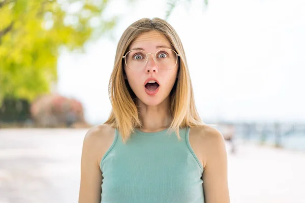 Young Blonde Woman Outdoors Glasses Surprised Expression — Stock Photo, Image