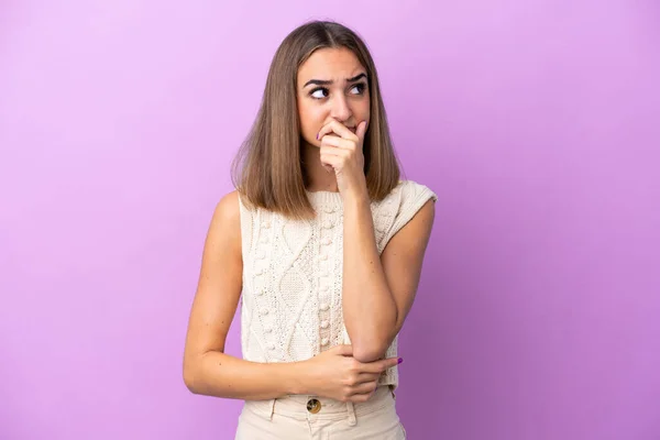 Young Caucasian Woman Isolated Purple Background Having Doubts Confuse Face — Stock Photo, Image
