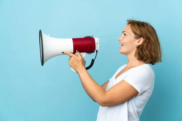 Young Georgian Woman Isolated Blue Background Shouting Megaphone Announce Something — Stock Photo, Image