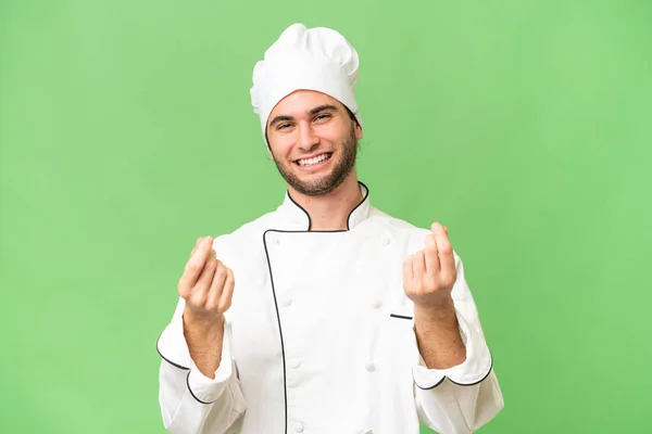 Junge Gut Aussehende Koch Mann Über Isolierten Hintergrund Machen Geld — Stockfoto