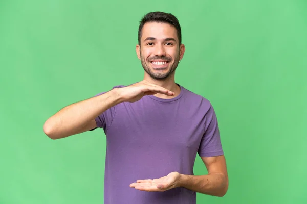 Young Handsome Caucasian Man Isolated Background Holding Copyspace Imaginary Palm — Stock Photo, Image