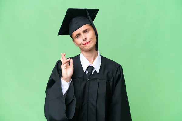 Young University Graduate Caucasian Woman Isolated Background Fingers Crossing Wishing — Stock Photo, Image