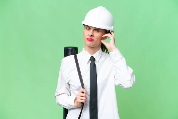 Young Architect Woman Helmet Holding Blueprints Isolated Background Having Doubts — 图库照片