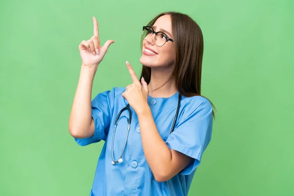 Young Nurse Caucasian Woman Isolated Background Pointing Index Finger Great — Stock fotografie