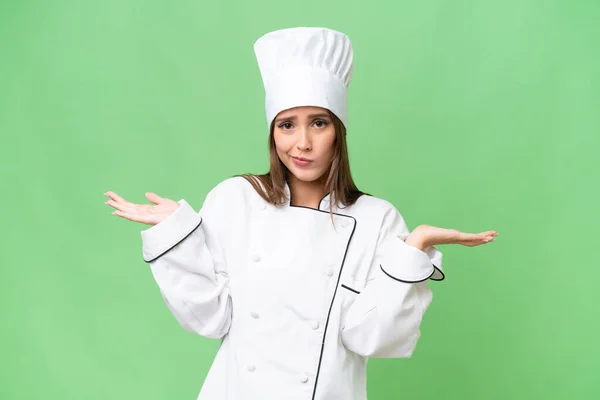 Young Chef Caucasian Woman Isolated Background Having Doubts While Raising — Stock Photo, Image