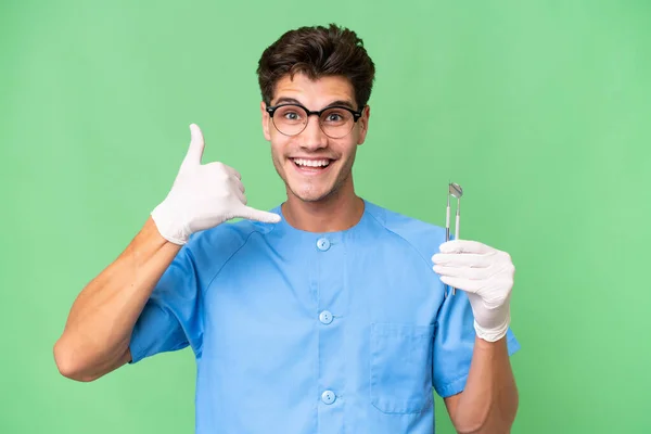 Homem Dentista Jovem Segurando Ferramentas Sobre Fundo Isolado Fazendo Gesto — Fotografia de Stock