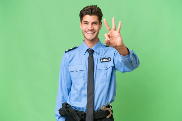 Молодий Поліцейський Над Ізольованим Тлом Щасливий Рахує Трьох Пальцями — стокове фото