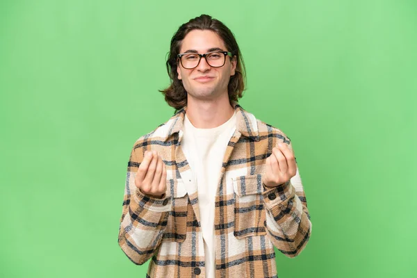 Young Caucasian Man Isolated Green Chroma Background Making Money Gesture — Stock Photo, Image