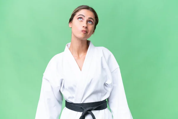 Mujer Uruguaya Joven Haciendo Karate Sobre Fondo Aislado Mirando Hacia — Foto de Stock