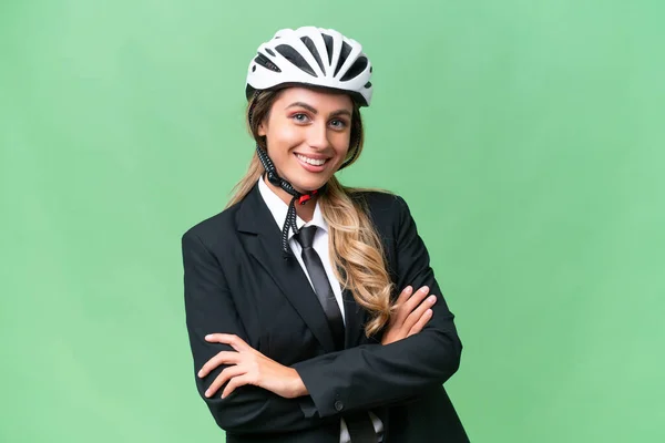 ビジネスウルグアイ女性身に着けていますヘルメットバイカー上の隔離された背景腕を保つ交差前位置 — ストック写真