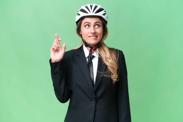 ビジネスウルグアイ女性身に着けていますヘルメットバイカー上の隔離された背景とともに指交差と願っています最高の — ストック写真