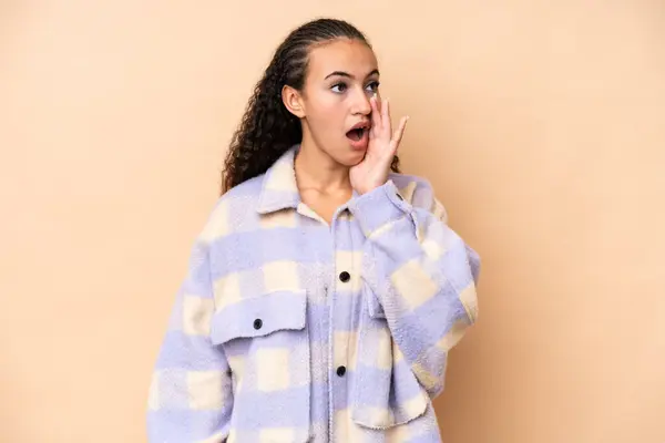 Young Woman Isolated Beige Background Whispering Something Surprise Gesture While — Stock Photo, Image