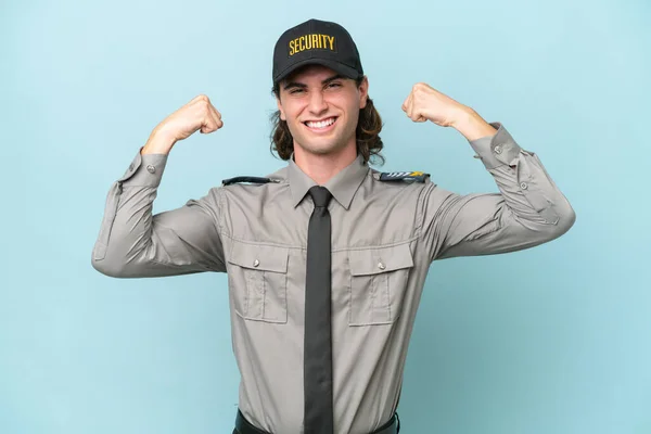 Young Safeguard Man Isolated Blue Background Doing Strong Gesture — Stock Photo, Image