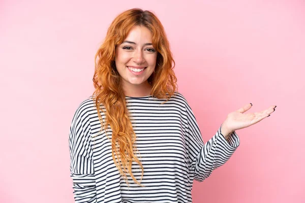 Young Caucasian Woman Isolated Pink Background Holding Copyspace Imaginary Palm — Stock Photo, Image