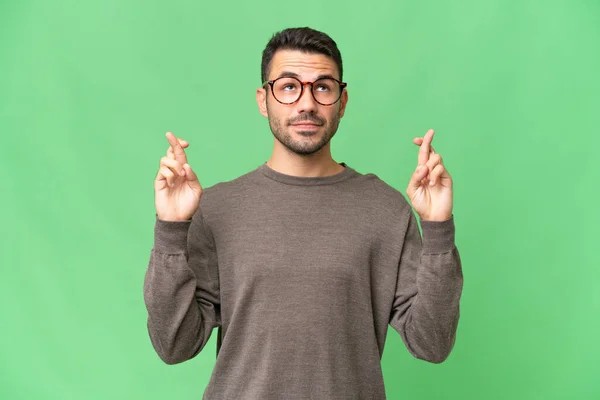 Young Handsome Caucasian Man Isolated Background Fingers Crossing Wishing Best — Stock Photo, Image