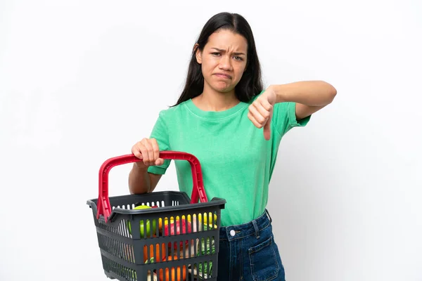Young Colombian Woman Holding Shopping Basket Full Food Isolated White — Stockfoto