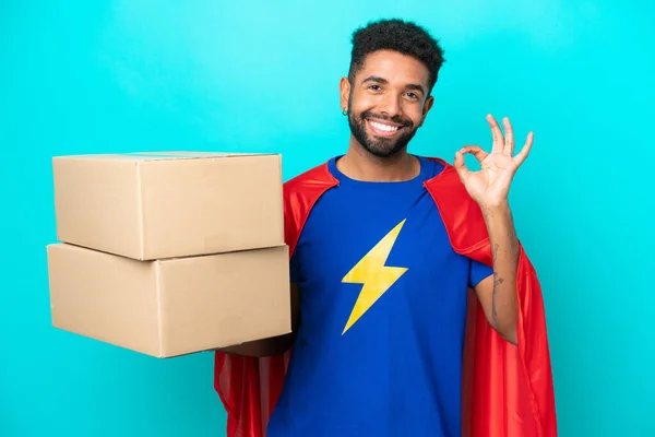Super Hero Delivery Brazilian Man Isolated Blue Background Showing Sign — Stock Photo, Image