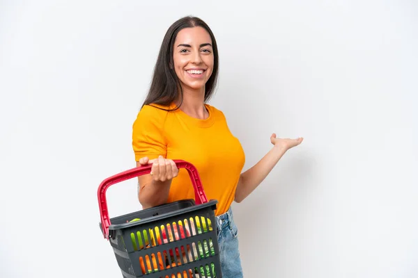 Young Caucasian Woman Holding Shopping Basket Full Food Isolated White — Fotografia de Stock