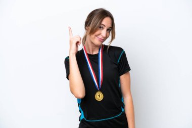 Young caucasian woman with medals isolated on white background pointing with the index finger a great idea