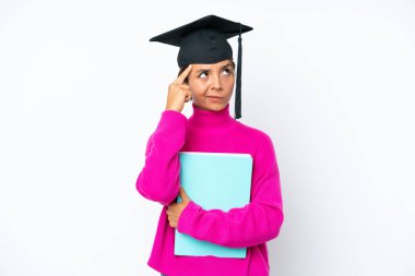 Young student hispanic woman holding a books isolated on white background having doubts and thinking